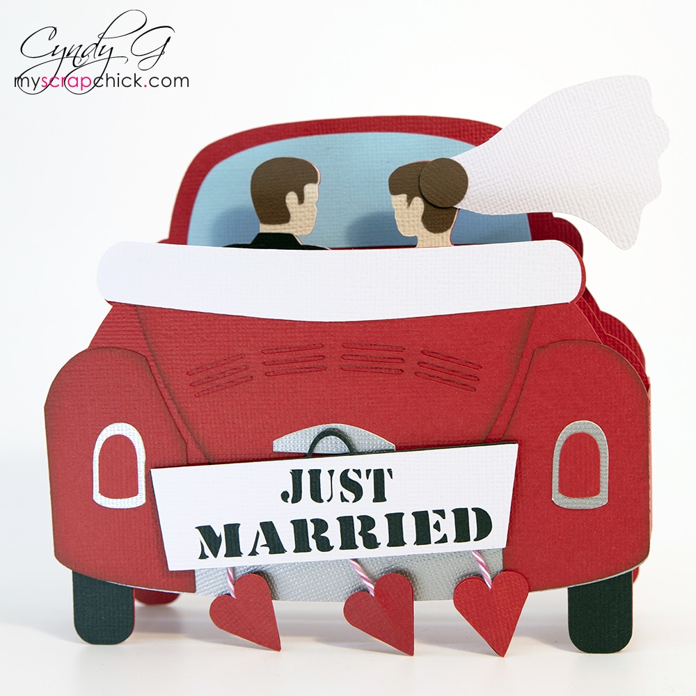 Car driving off with married couple wedding card